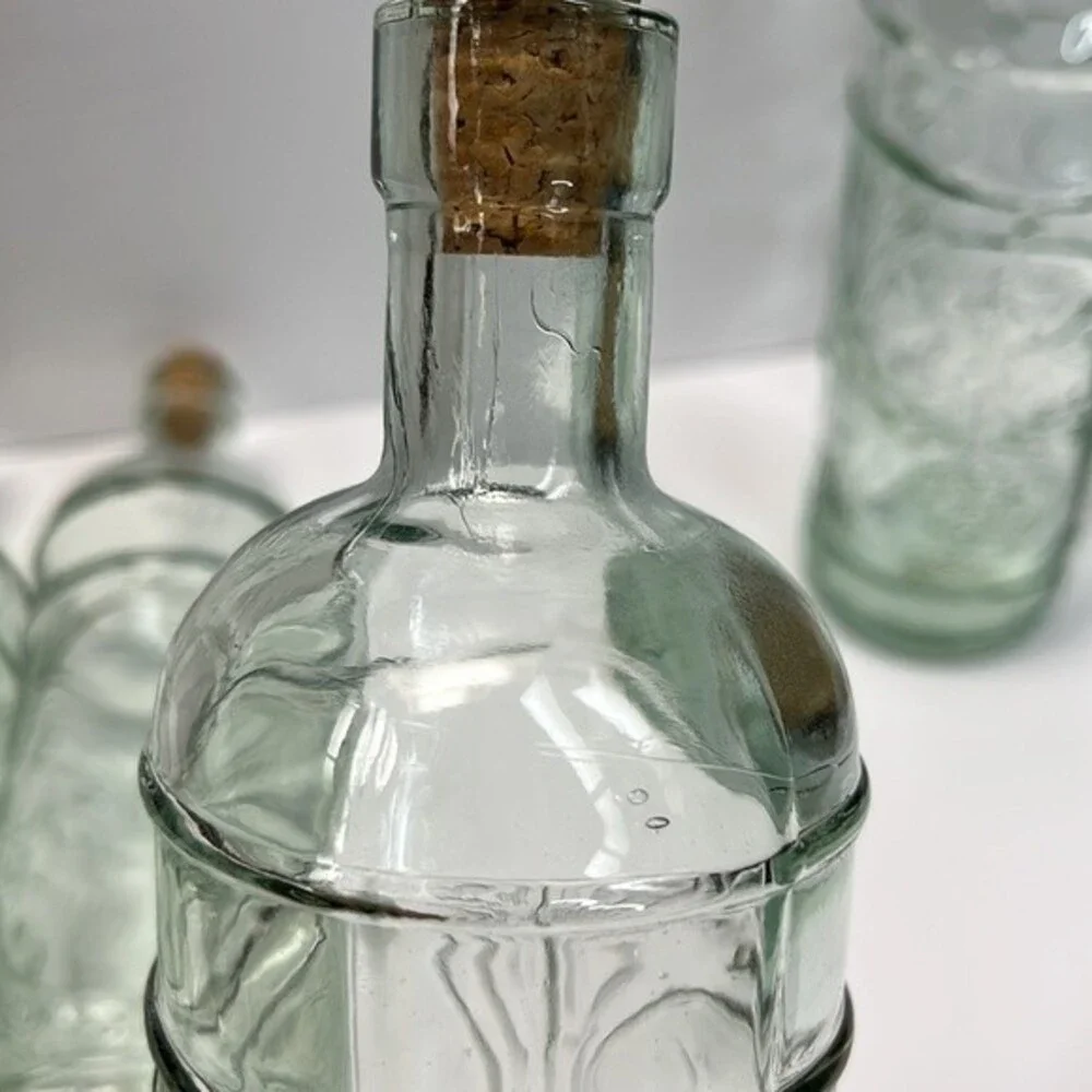 William Sonoma made in Spain Embossed Clear Green Glass Bottles set of 3